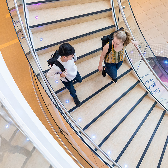Students walking down stairs